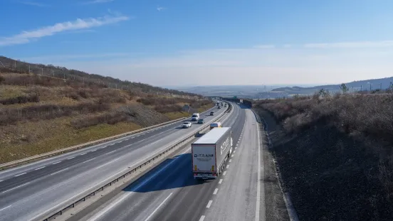 Traffic on the D8 motorway between Dresden and Prague with trucks and cars on a sunny day, captured on February 20, 2026